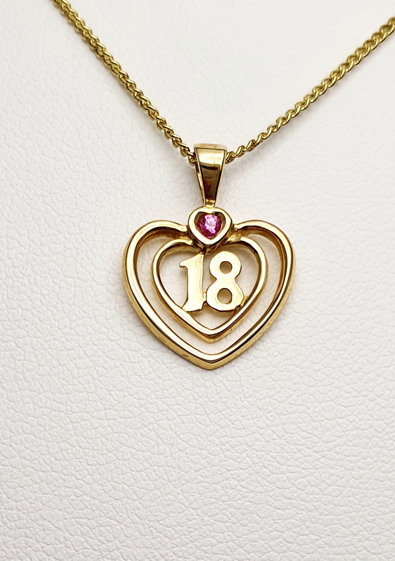 9ct Yellow Gold "18" Heart Pendant set with a Pink Sapphire