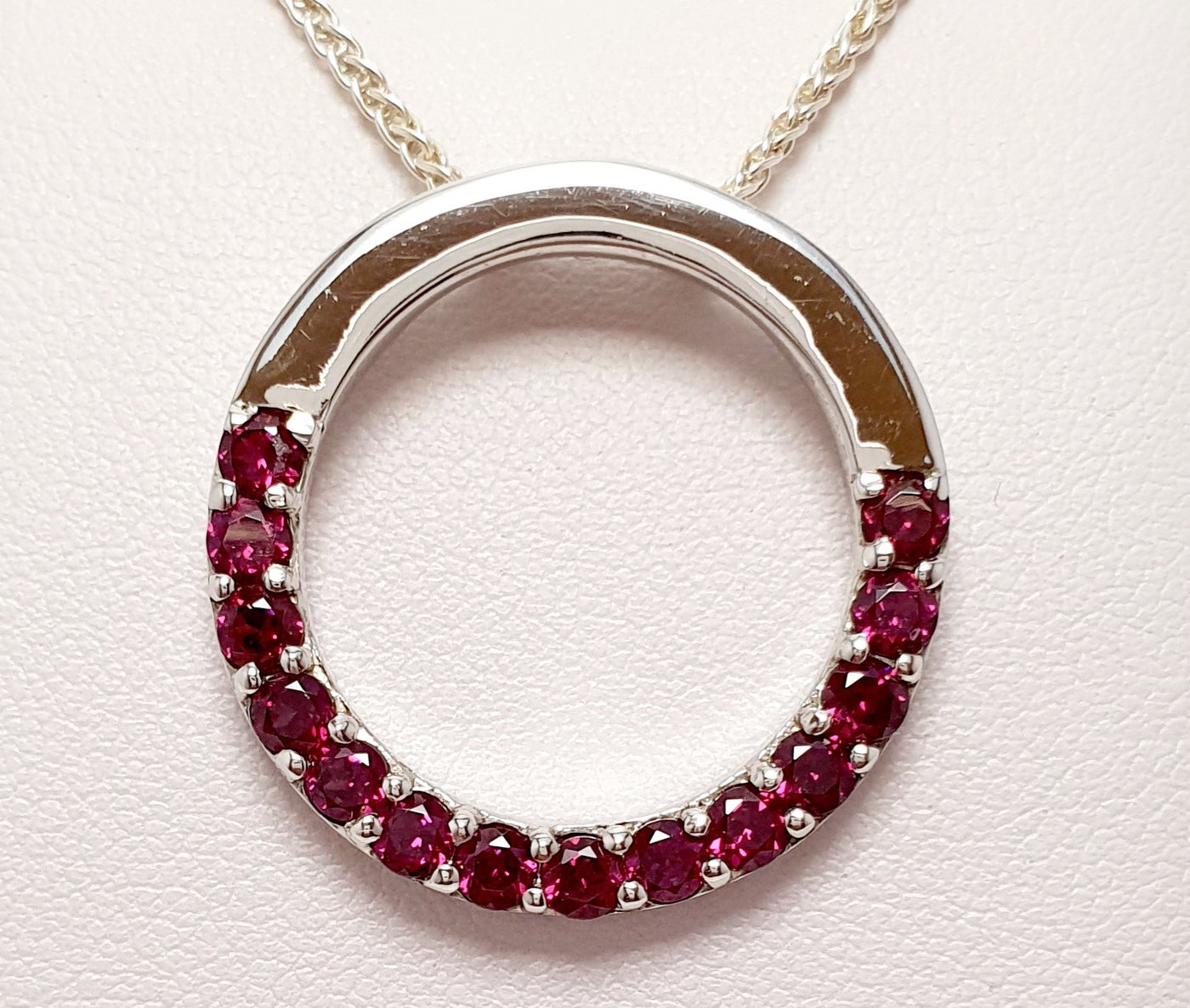 Sterling Silver Circular Pendant With Rhodolite Garnets