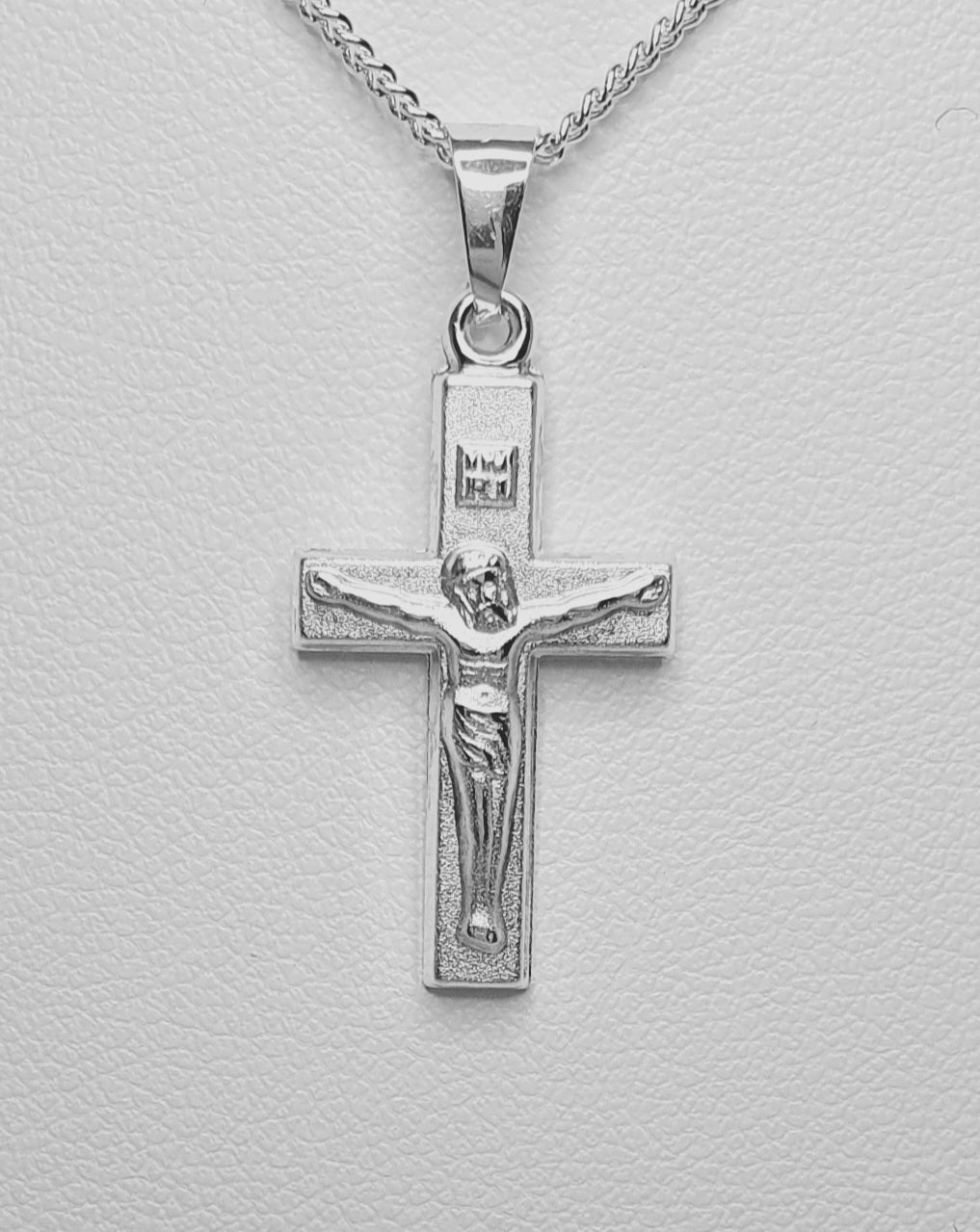 Sterling Silver Matte Finish Crucifix Pendant. 28mm From top of Bail to Bottom of Crucifix.