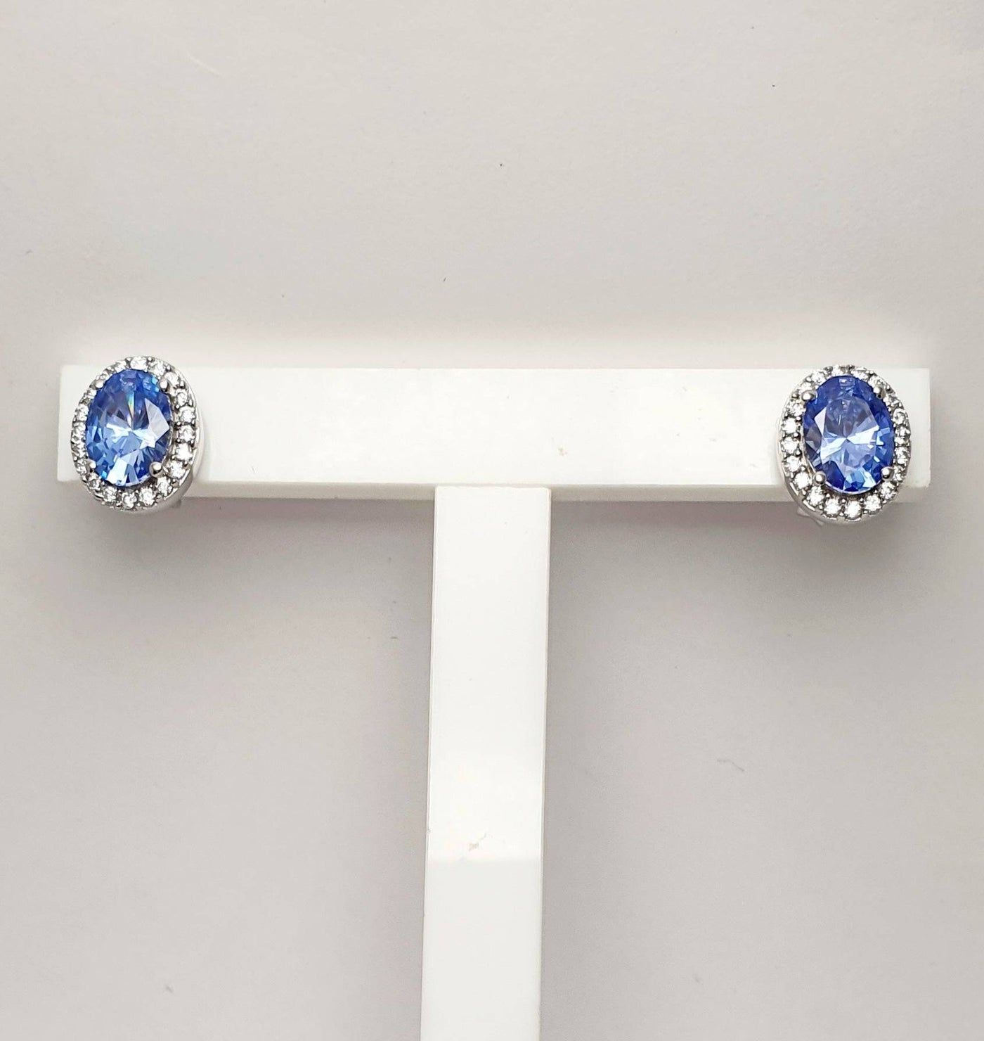 Sterling Silver Fancy Blue Oval Cubic Zirconia Earrings with White CZ Surround