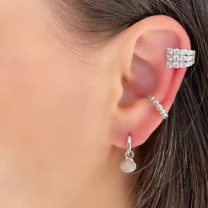 Mirage Ear Cuff three rows of white CZ, sterling silver setting, this ear cuff will be the star of the show.